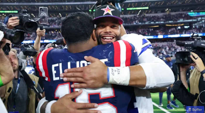 Elliott shares a post game hug with former Dallas Cowboys teammate Dak Prescott